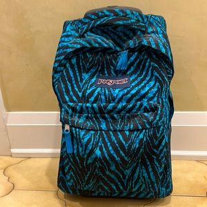Black and blue Jansport school bag with wheels